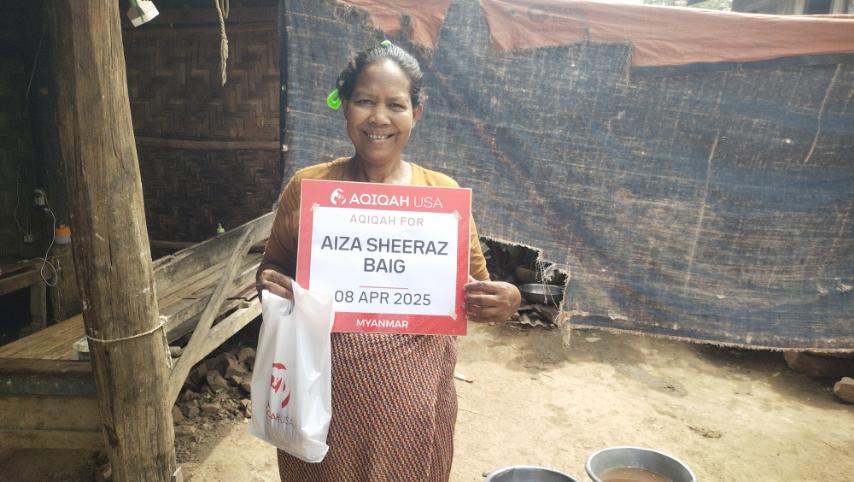 Smiling elderly Muslim woman in Myanmar grateful for Aqiqah meat donation